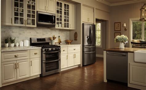 kitchens with black stainless steel appliances and cream cabinets|black and white kitchen appliances.